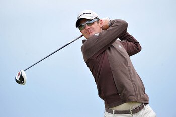 SANDWICH, ENGLAND - JULY 13:  Justin Rose of England tees off during the final practice round during The Open Championship at Royal St. George's on July 13, 2011 in Sandwich, England. The 140th Open begins on July 14, 2011..  (Photo by Stuart Franklin/Get