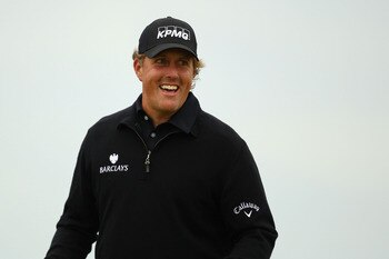 SANDWICH, ENGLAND - JULY 13:  Phil Mickelson of the USA walks across a green during the final practice round during The Open Championship at Royal St. George's on July 13, 2011 in Sandwich, England. The 140th Open begins on July 14, 2011..  (Photo by Rich