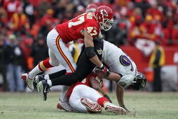 KANSAS CITY, MO - JANUARY 09:  Tight end Todd Heap #86 of the Baltimore Ravens makes pass reception and is tackled by safety Jon McGraw #47 and linebacker Derrick Johnson #56 of the Kansas City Chiefs during their 2011 AFC wild card playoff game against a