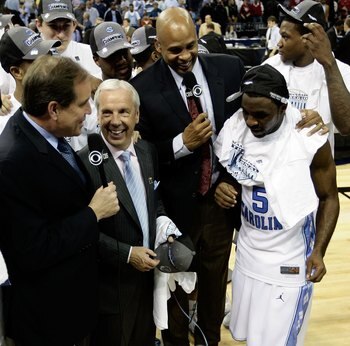 MEMPHIS, TN - MARCH 29:  CBS broadcasters Jim Nantz (L) and Clark Kellogg (2nd R) interview head coach Roy Williams (2nd L) and Ty Lawson #5 (R) of the North Carolina Tar Heels after the Tar Heels defeated the Oklahoma Sooners during the NCAA Men's Basket