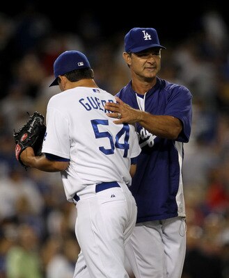 LOS ANGELES, CA - JULY 08:  Relief pitcher Javy Guerra #54 of the Los Angeles Dodgers is congratulated by manager Don Mattingly after Guerra got the last out and the save against the San Diego Padres on July 8, 2011 at Dodger Stadium in Los Angeles, Calif