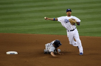 LOS ANGELES, CA - JULY 8: Shortstop Rafael Furcal #15 of the Los Angeles Dodgers turns a double play after forcing out Will Venable #25 of the San Diego Padres in the third inning on July 8, 2011 at Dodger Stadium in Los Angeles, California. (Photo by