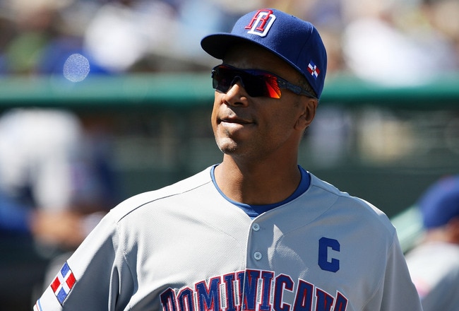 JUPITER, FL - MARCH 3:  Moises Alou #18 of the Dominican Republic smiles in the dugout while taking on the Florida Marlins during an exhibition game at Roger Dean Stadium March 3, 2009 in Jupiter, Florida.  (Photo by Doug Benc/Getty Images)
