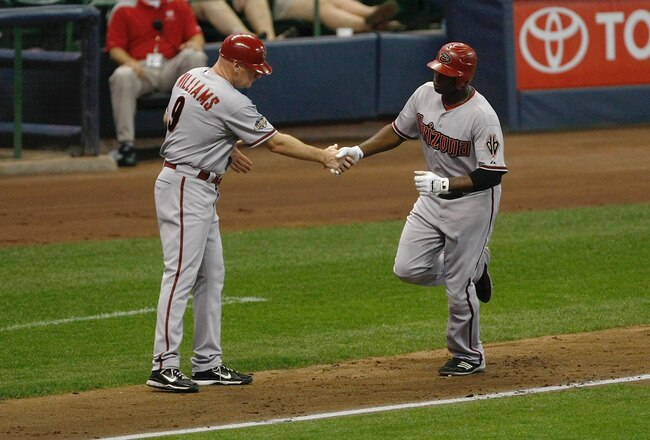 MILWAUKEE, WI - JULY 5: Justin Upton #10 of the Arizona Diamondbacks is congratulated by Matt Williams #9 as he runs the bases after hitting a home run against the Milwaukee Brewers at the Miller Park on July 5, 2011 in Milwaukee, Wisconsin. (Photo by Sco