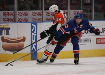 NEW YORK - JANUARY 10: Scott Hartnell #19 of the Philadelphia Flyers is checked by Jaromir Jagr #68 of the New York Rangers on January 10, 2008 at Madison Square Garden in New York City. The Flyers defeated the Rangers 6-2. (Photo by Bruce Bennett/Getty I