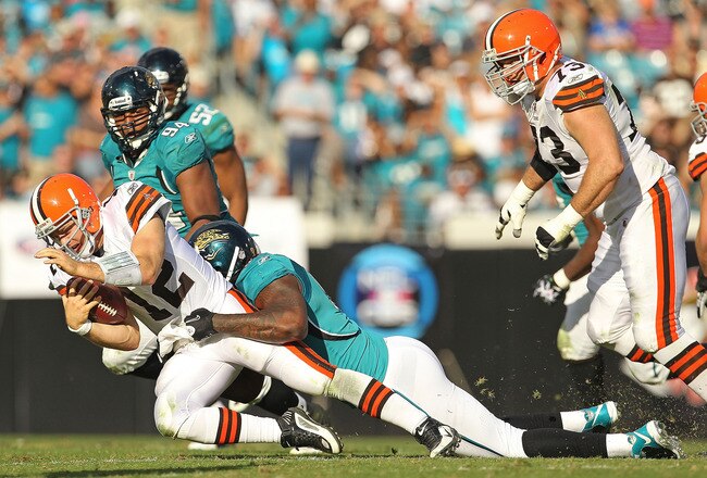 JACKSONVILLE, FL - NOVEMBER 21:  Colt McCoy #12  of the Cleveland Browns is sacked by Larry Hart #59  during a game agaisnt the Jacksonville Jaguars at EverBank Field on November 21, 2010 in Jacksonville, Florida.  (Photo by Mike Ehrmann/Getty Images)
