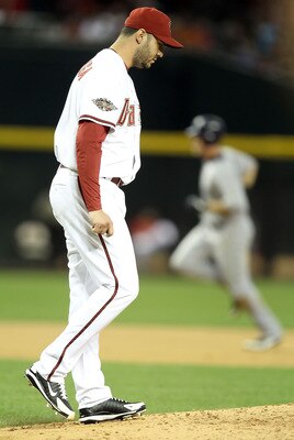 PHOENIX, AZ - MAY 16:  Starting pitcher Armando Galarraga #59 of the Arizona Diamondbacks reacts after giving up a two run home run to Ryan Ludwick #47 of the San Diego Padres during the fifth inning of the Major League Baseball game at Chase Field on May