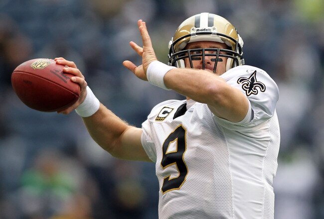 SEATTLE, WA - JANUARY 08:  Quarterback Drew Brees #9 of the New Orleans Saints warms-up before taking on the Seattle Seahawks during the 2011 NFC wild-card playoff game at Qwest Field on January 8, 2011 in Seattle, Washington.  (Photo by Jonathan Ferrey/G