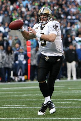 SEATTLE, WA - JANUARY 08:  Quarterback Drew Brees #9 of the New Orleans Saints throws the ball against the Seattle Seahawks during the 2011 NFC wild-card playoff game at Qwest Field on January 8, 2011 in Seattle, Washington.  (Photo by Jonathan Ferrey/Get