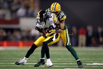 ARLINGTON, TX - FEBRUARY 06:  Emmanuel Sanders #88 of the Pittsburgh Steelers makes a reception against Tramon Williams #38 of the Green Bay Packers during Super Bowl XLV at Cowboys Stadium on February 6, 2011 in Arlington, Texas. The Packers won 31-25. (