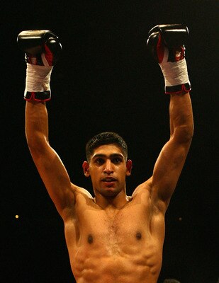 LONDON - FEBRUARY 17: Amir Kahn of England celebrates after defeating Mohammed Medjadji of France after their International Lightweight contest at Wembley Arena on February 17, 2007 in London, England.  (Photo by Ryan Pierse/Getty Images)