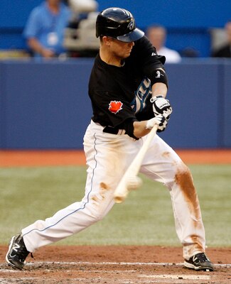 TORONTO, CANADA - JULY 14: Aaron Hill #2 of the Toronto Blue Jays hits against the New York Yankees during MLB action at The Rogers Centre July 14, 2011 in Toronto, Ontario, Canada. (Photo by Abelimages/Getty Images)