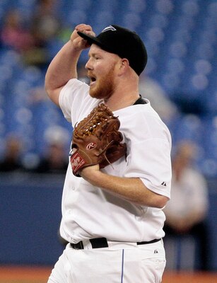 TORONTO, CANADA - MAY 18: Jesse Litsch #51 of the Toronto Blue Jays reacts to the 6th run being scored against the Tampa Bay Rays during MLB action at the Rogers Centre May 18, 2011 in Toronto, Ontario, Canada. (Photo by Abelimages/Getty Images)