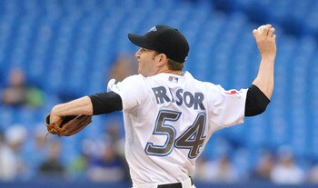 TORONTO, CANADA - JUNE 1:  Jason Frasor #54 of the Toronto Blue Jays delivers a pitch during game action against the Cleveland Indians June 1, 2011 at Rogers Centre in Toronto, Ontario, Canada. (Photo by Brad White/Getty Images)