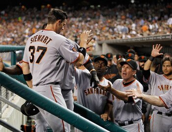 DETROIT, MI - JULY 01: Chris Stewart #37 of the San Francisco Giants celebrates with teammates after scoring on a ninth inning bases loaded walk while playing the Detroit Tigers at Comerica Park on July 1,  2011 in Detroit, Michigan. San Francisco won the