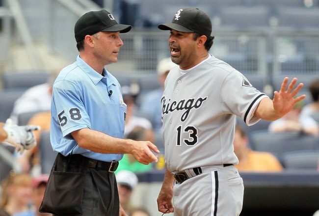 NEW YORK - MAY 02:  Manager Ozzie Guillen of the Chicago White Sox argues with home plate umpire Dan Iassogna during the game against the New York Yankees on May 2, 2010 at Yankee Stadium in the Bronx borough of New York City. The Yankees defeated the Whi