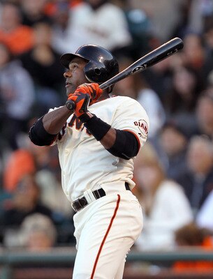 SAN FRANCISCO, CA - JULY 10:  Miguel Tejada #10 of the San Francisco Giants hits a single that scored Mike Fontenot #14 in the seventh inning of their game against the New York Mets at AT&T Park on July 10, 2011 in San Francisco, California.  (Photo by Ez