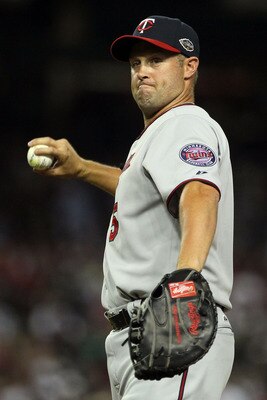 PHOENIX, AZ - JULY 12:  American League All-Star Michael Cuddyer #5 of the Minnesota Twins throws the ball during the 82nd MLB All-Star Game at Chase Field on July 12, 2011 in Phoenix, Arizona.  (Photo by Jeff Gross/Getty Images)