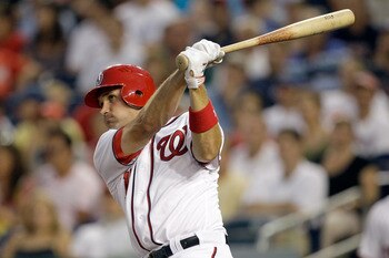 WASHINGTON, DC - JULY 06: Ryan Zimmerman #11 of the Washington Nationals follows his two run home run against the Chicago Cubs during the fifth inning at Nationals Park on July 6, 2011 in Washington, DC.  (Photo by Rob Carr/Getty Images)