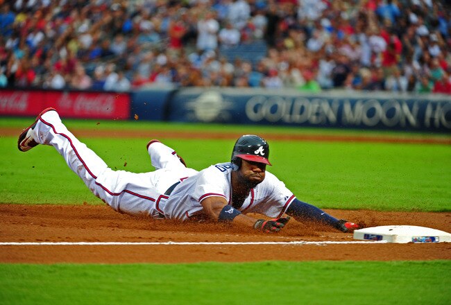 ATLANTA - JULY 15: Jason Heyward #22 of the Atlanta Braves dives in to third base against the Washington Nationals at Turner Field on July 15, 2011 in Atlanta, Georgia. (Photo by Scott Cunningham/Getty Images)