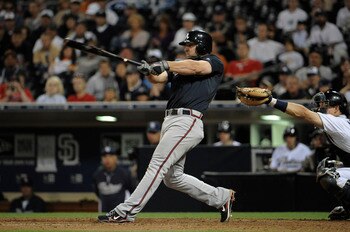 SAN DIEGO, CA - JUNE 25: Dan Uggla #26 of the Atlanta Braves connects for a three-run homer during the ninth inning of a baseball game against the San Diego Padres at Petco Park on June 25, 2011 in San Diego, California. The Braves won 10-1.  (Photo by De