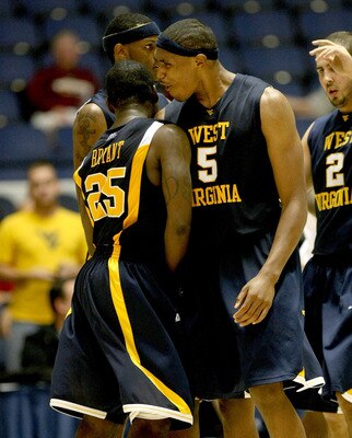 ANAHEIM, CA - NOVEMBER 27: Kevin Jones #5 and Darryl Bryant #25 of the West Virginia Mountaineers celebrate during the game with the Texas A&M Aggies at the 76 Classic at Anaheim Convention Center on November 27, 2009 in Anaheim, California.  West Virgini