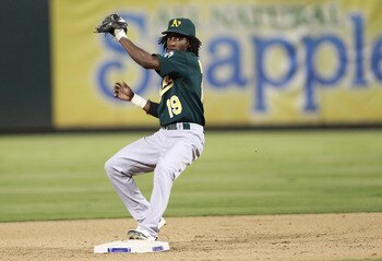 ARLINGTON, TX - JULY 7: Jemile Weeks #19 of the Oakland Athletics makes the out on the forced run and the throw to first base for a double play against the Texas Rangers at Rangers Ballpark in Arlington on July 7, 2011 in Arlington, Texas. (Photo by Rick