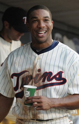 MINNEAPOLIS, MN - JULY 15: Ben Revere #11 of the Minnesota Twins smiles in the dugout after scoring on a wild pitch by Luke Hochevar #44 of the Kansas City Royals in the fourth inning on July 15, 2011 at Target Field in Minneapolis, Minnesota. (Photo by H