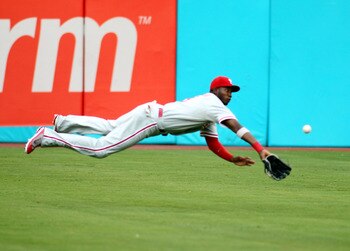 MIAMI GARDENS, FL - JULY 05:  Outfielder Domonic Brown #9 dives for a ball against the Florida Marlins at Sun Life Stadium on July 5, 2011 in Miami Gardens, Florida.  (Photo by Marc Serota/Getty Images)
