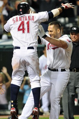 CLEVELAND, OH - JULY 7: Carlos Santana #4 celebrates with Travis Hafner #48 after Hafner's walk off grand slam home run against the Toronto Blue Jays at Progressive Field on July 7, 2011 in Cleveland, Ohio. The Indians defeated Blue Jays 5-4. (Photo by Ja
