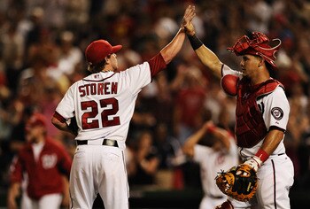 WASHINGTON, DC - JUNE 22: Pitcher Drew Storen #22 of the Washington Nationals and catcher Wilson Ramos #3 celebrate after defeating the Seattle Mariners at Nationals Park on June 22, 2011 in Washington, DC. The Washington Nationals won, 2-1. (Photo by Pat