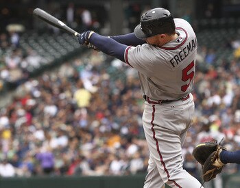 SEATTLE - JUNE 29:  Freddie Freeman #5 of the Atlanta Braves hits a two-run single in the fifth inning against the Seattle Mariners at Safeco Field on June 29, 2011 in Seattle, Washington. The Braves defeated the Mariners 5-3. (Photo by Otto Greule Jr/Get