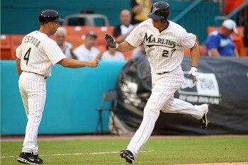 MIAMI GARDENS, FL - JULY 07:  Mike Stanton #27 of the Florida Marlins celebrates a two-run home run with third base coach Joey Espada #4 against the Houston Astros at Sun Life Stadium on July 7, 2011 in Miami Gardens, Florida.  (Photo by Marc Serota/Getty