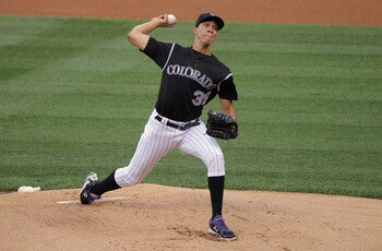 DENVER, CO - JULY 14:  Starting pitcher Ubaldo Jimenez #38 of the Colorado Rockies delviers against the Milwaukee Brewers at Coors Field on July 14, 2011 in Denver, Colorado. Jimenez earned the win as the Rockies defeated the Brewers 12-3.  (Photo by Doug