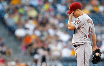 PITTSBURGH - JULY 05:  Wandy Rodriguez #51 of the Houston Astros wipes the sweat off of his face in between pitches against the Pittsburgh Pirates during the game on July 5, 2011 at PNC Park in Pittsburgh, Pennsylvania.  (Photo by Jared Wickerham/Getty Im