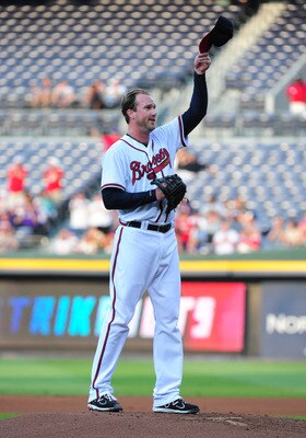 ATLANTA - JULY 5: Derek Lowe #32 of the Atlanta Braves acknowledges the crowd after recording his 1,600th career strikeout during the game against the Colorado Rockies at Turner Field on July 5, 2011 in Atlanta, Georgia. (Photo by Scott Cunningham/Getty I