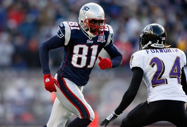 FOXBORO, MA - JANUARY 10:  Randy Moss #81 of the New England Patriots runs a route against Dominique Foxworth #24 of the Baltimore Ravens during the 2010 AFC wild-card playoff game at Gillette Stadium on January 10, 2010 in Foxboro, Massachusetts.  (Photo
