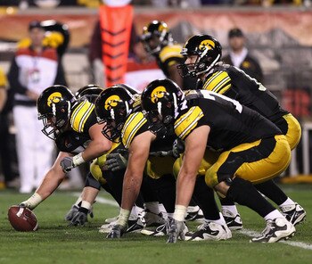 TEMPE, AZ - DECEMBER 28:  Quarterback Ricky Stanzi #12 of the Iowa Hawkeyes prepares to snap the ball during the Insight Bowl against the Missouri Tigers at Sun Devil Stadium on December 28, 2010 in Tempe, Arizona.  The Hawkeyes defeated the Tigers 27-24.