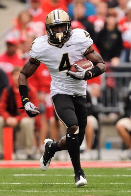 COLUMBUS, OH - OCTOBER 23:  O.J. Ross #4 of the Purdue Boilermakers runs with the ball against the Ohio State Buckeyes at Ohio Stadium on October 23, 2010 in Columbus, Ohio.  (Photo by Jamie Sabau/Getty Images)