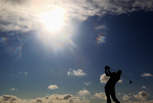 SANDWICH, ENGLAND - JULY 16:   Dustin Johnson of the United States tee's off at the 18th during the third round of The 140th Open Championship at Royal St George's on July 16, 2011 in Sandwich, England. (Photo by Streeter Lecka/Getty Images)