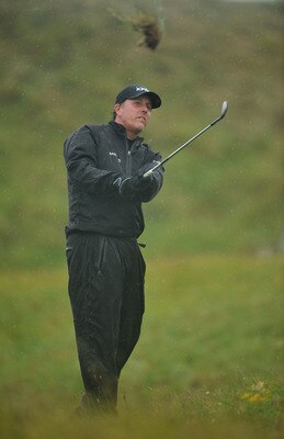 SANDWICH, ENGLAND - JULY 16:  Phil Mickelson of USA hits from the rough on the 5th hole  during the third round of The 140th Open Championship at Royal St George's on July 16, 2011 in Sandwich, England.  (Photo by Stuart Franklin/Getty Images)