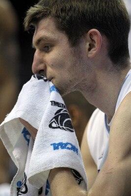 NEWARK, NJ - MARCH 27:  Tyler Zeller #44 of the North Carolina Tar Heels wipes his face on the bench during a timeout in the first half of the game against the Kentucky Wildcats in the east regional final of the 2011 NCAA men's basketball tournament at Pr