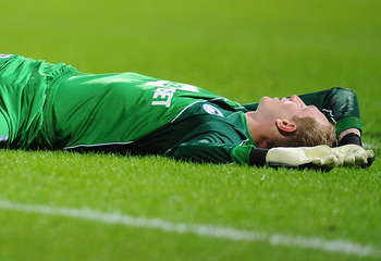 BOLTON, ENGLAND - JANUARY 05:  Chris Kirkland of Wigan Athletic is injured in a chellenge and stretchered off during the Barclays Premier League match between Bolton Wanderers and Wigan Athletic at Reebok Stadium on January 5, 2011 in Bolton, England.  (P