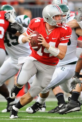 COLUMBUS, OH - SEPTEMBER 25:  Joe Bauserman #14 of the Ohio State Buckeyes rolls out to pass against the Eastern Michigan Eagles at Ohio Stadium on September 25, 2010 in Columbus, Ohio.  Ohio State won 73-20. (Photo by Jamie Sabau/Getty Images)