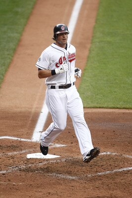 CLEVELAND, OH - JUNE 22:  Travis Buck #28 of the Cleveland Indians scores the first run during the game against the Colorado Rockies on June 22, 2011 at Progressive Field in Cleveland, Ohio.  The Cleveland Indians defeated the Colorado Rockies 4-3. (Photo