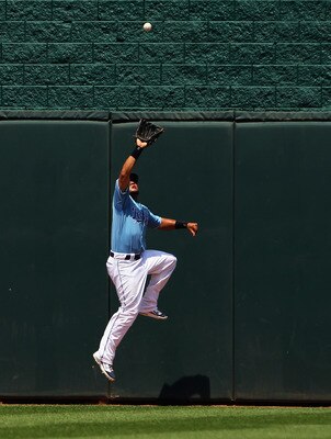 KANSAS CITY, MO - JULY 10:  Melky Cabrera #53 of the Kansas City Royals catches a fly ball at the centerfield wall during the game against the Detroit Tigers on July 10, 2011 at Kauffman Stadium in Kansas City, Missouri.  (Photo by Jamie Squire/Getty Imag