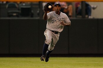 DENVER, CO - JULY 15:  Center fielder Nyjer Morgan #2 of the Milwaukee Brewers fields a one-hop RBI single by Todd Helton of the Colorado Rockies at Coors Field on July 15, 2011 in Denver, Colorado.  The Rockies defeated the Brewers 4-0. (Photo by Justin
