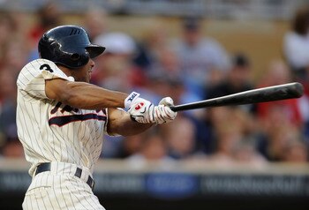 MINNEAPOLIS, MN - JULY 15: Ben Revere #11 of the Minnesota Twins hits a single against the Kansas City Royals in the fourth inning on July 15, 2011 at Target Field in Minneapolis, Minnesota. (Photo by Hannah Foslien/Getty Images)