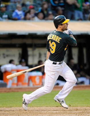 OAKLAND, CA - JULY 16: Scott Sizemore #29 of the Oakland Athletics hits a walk off RBI double against the Los Angeles Angels of Anaheim in the tenth inning to win game two of a double header at the O.co Coliseum July 16, 2011 in Oakland, California. The A