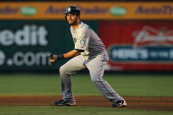 ANAHEIM, CA - JULY 09:  Dustin Ackley #13 of the Seattle Mariners leads off of first base against the Los Angeles Angels of Anaheim at Angel Stadium of Anaheim on July 9, 2011 in Anaheim, California.  (Photo by Jeff Gross/Getty Images)